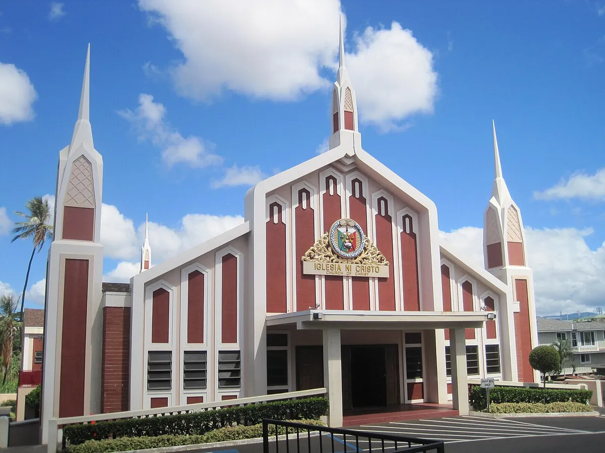 Iglesia ni Cristo church in Waipahu with tall white spires under a blue sky